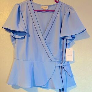 Baby blue going to a gender reveal or baby shower ? Here’s the perfect blouse